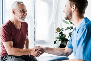 financial expert speaking with client about their life insurance coverage