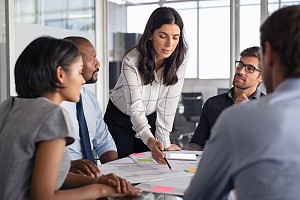 coworkers coming together to discuss strategies