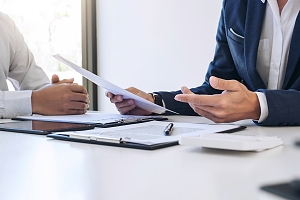 insurance agent negotiating a contract with an employee