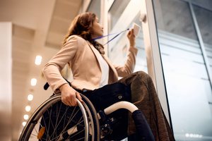 A female employee entering the office in a wheelchair