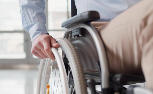 A man riding a wheelchair