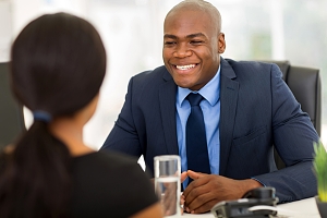 insurance agent speaking with a professional about insurance