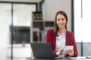 A female insurance agent calculating her income tax